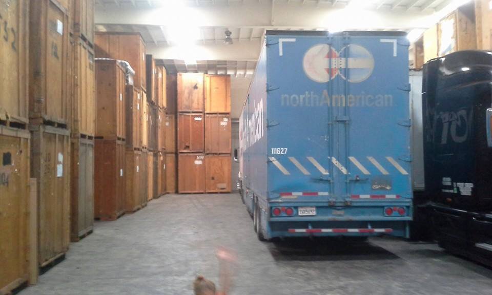 Local storage facility and movers truck in warehouse
